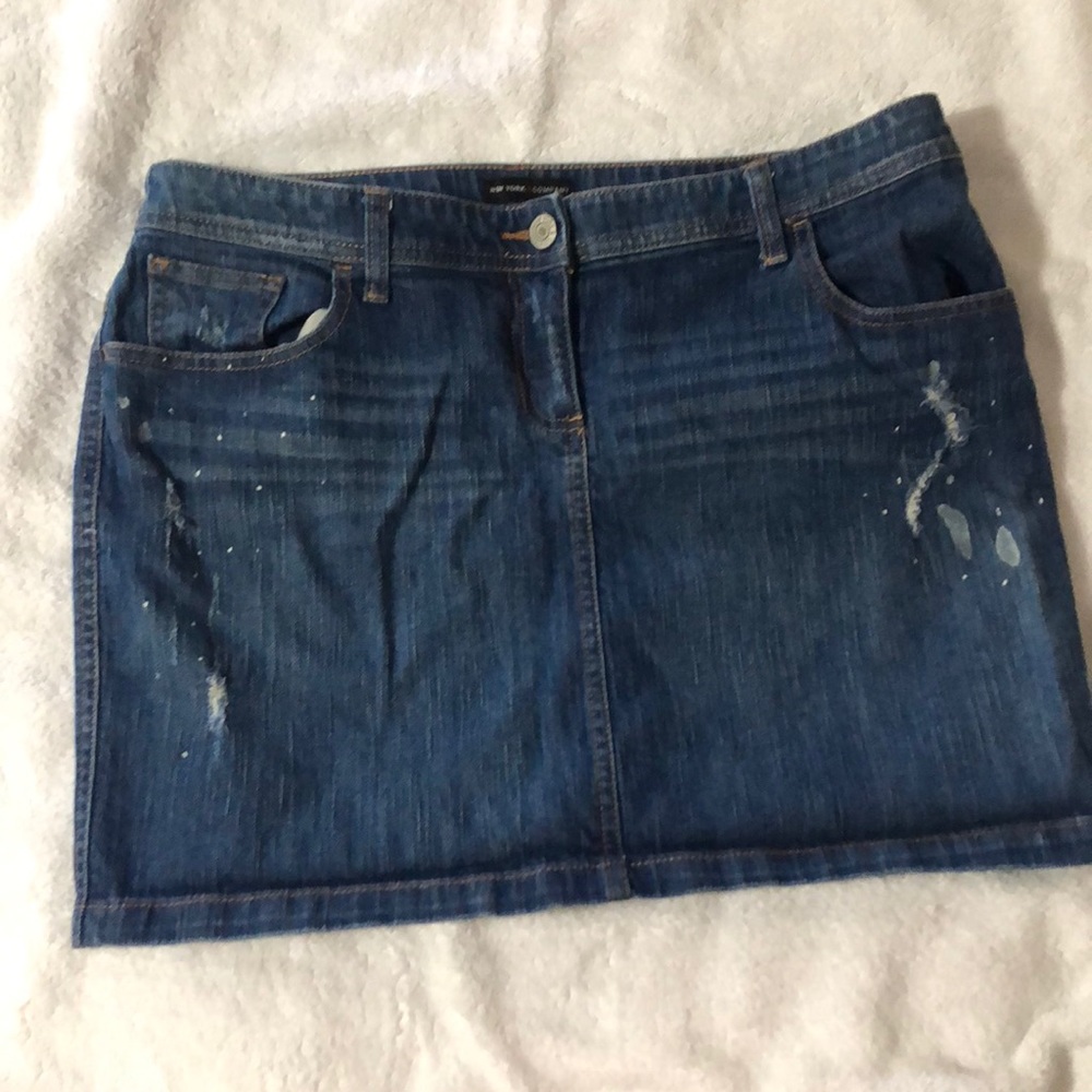 distressed jean skirt with white “paint” splatter